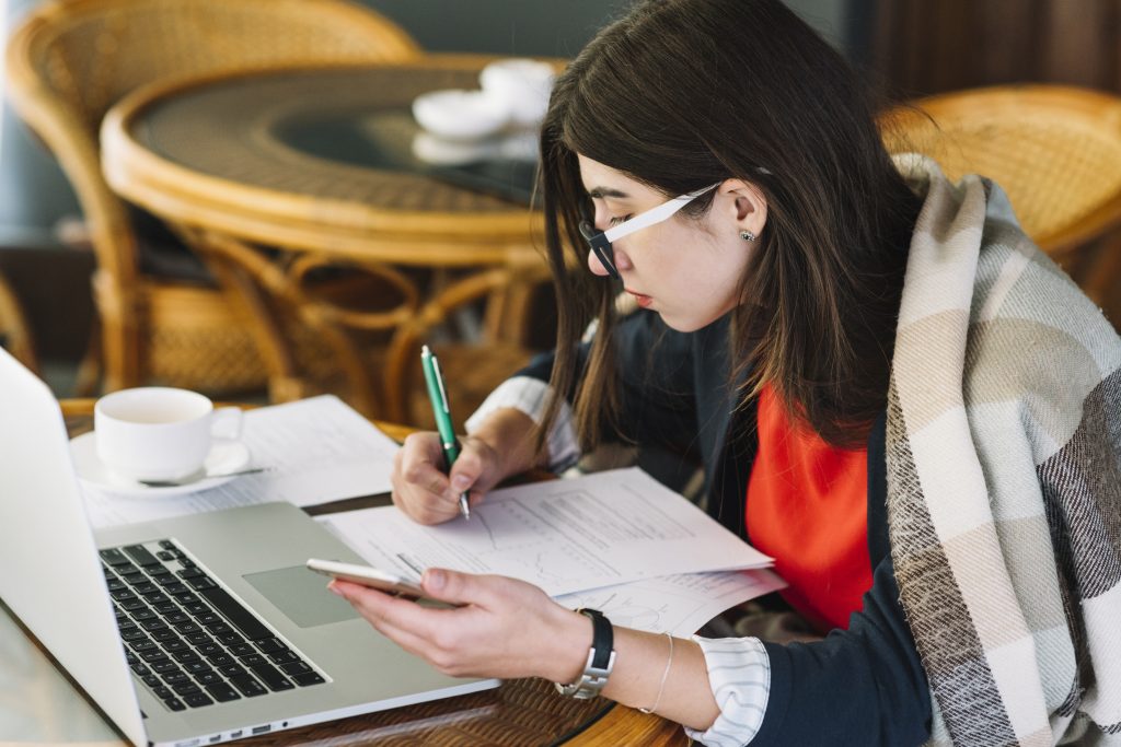 businesswoman using laptop coffee shop